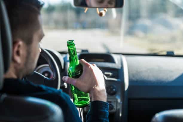 Driver holding a beer bottle behind the wheel – high range PCA penalties